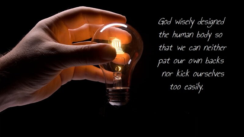 Hand Holding Light Bulb — Black