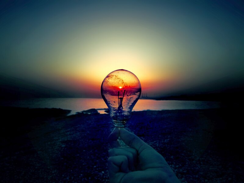 Hand Holding Light Bulb — Blue, Dramatic