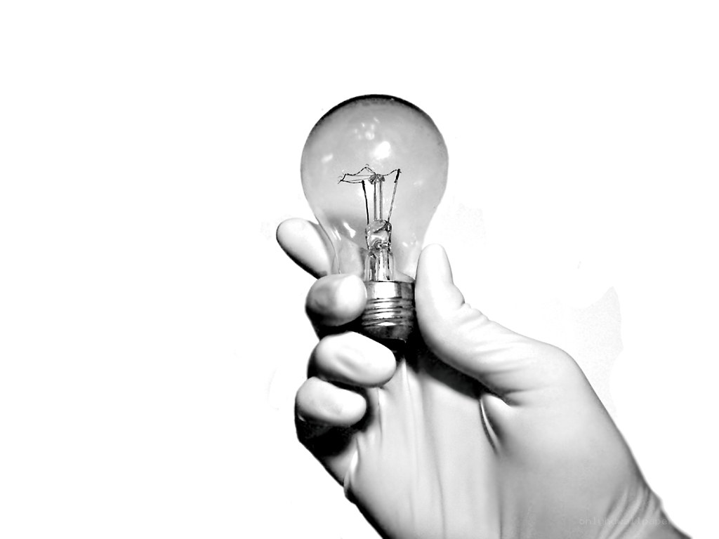 hand holding light bulb