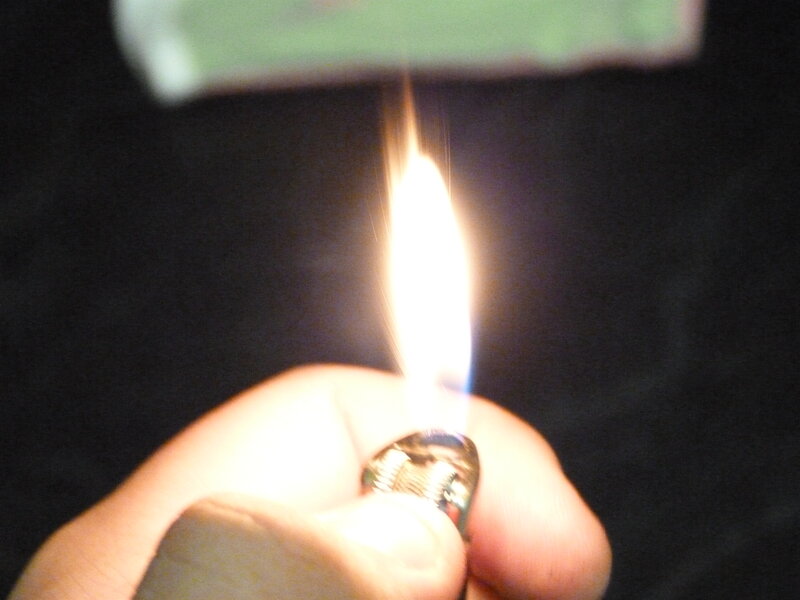 Hand Holding Lighter — Black