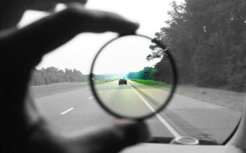 Hand Holding Magnifying Glass — Black, Calm
