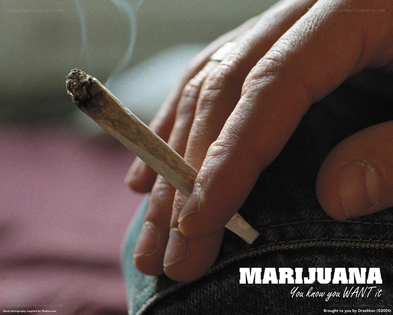 hand holding marijuana cigarette