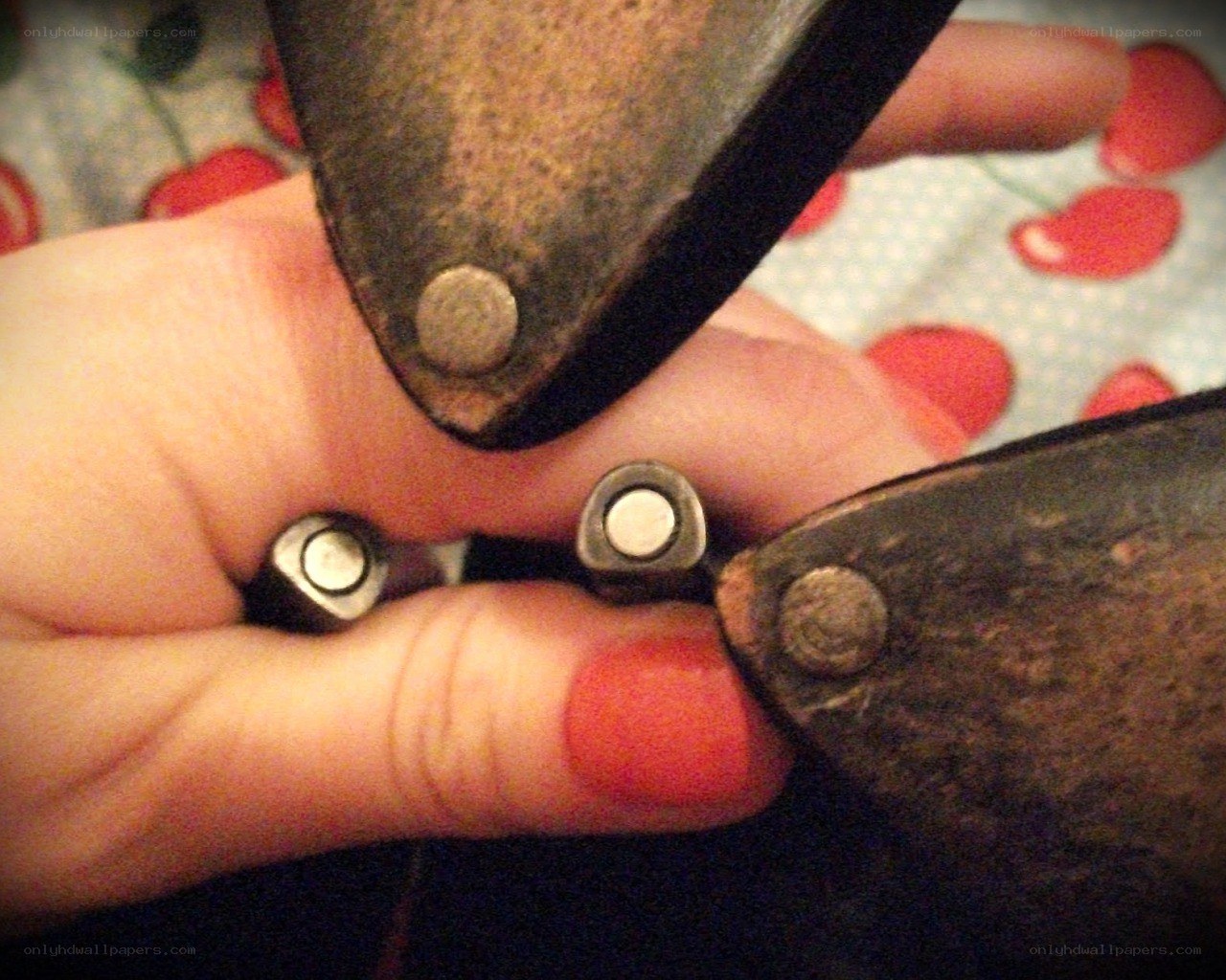 Hand holding metal objects