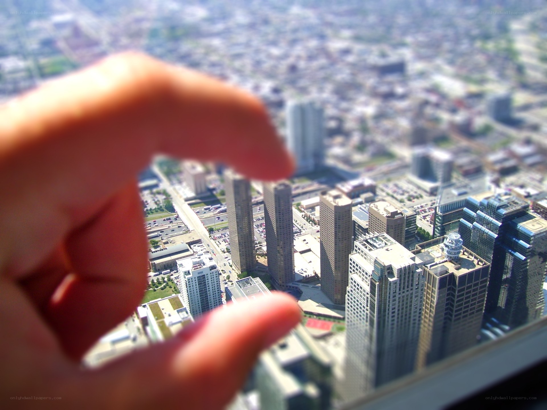 hand holding miniature city view