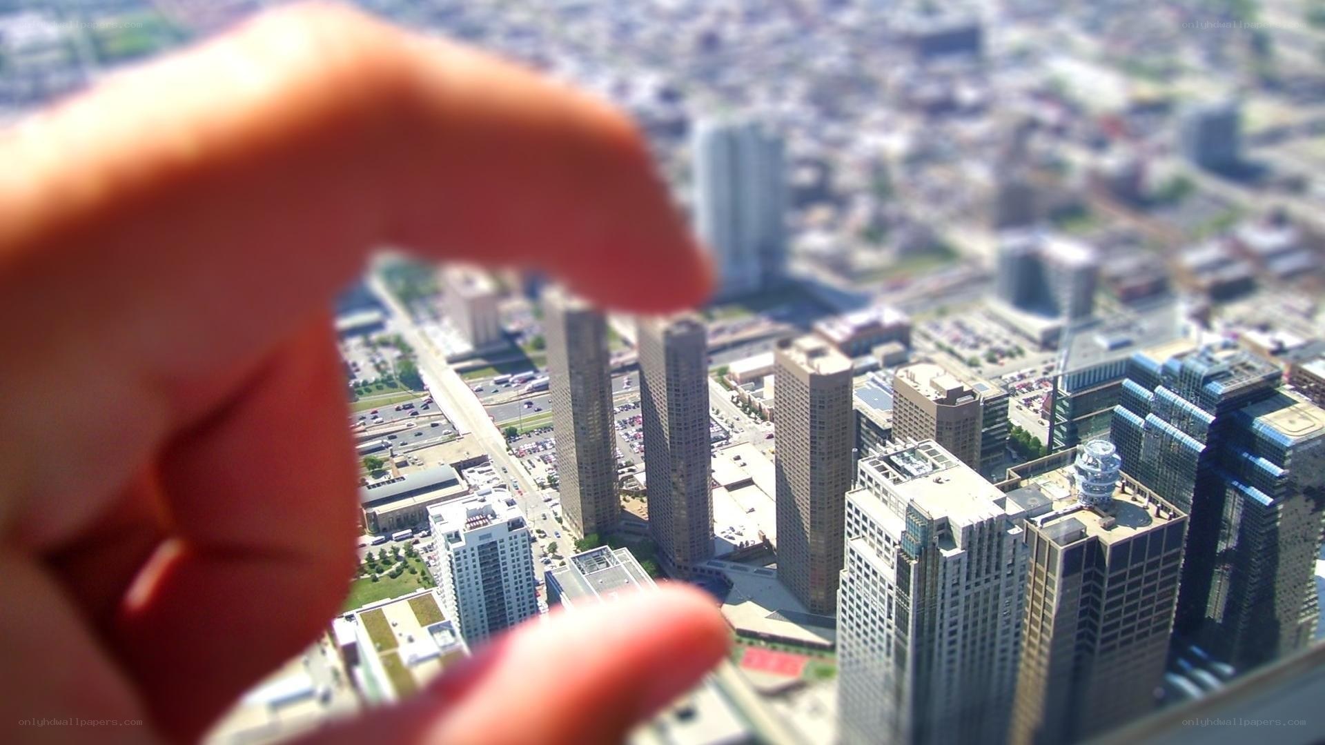 hand holding miniature city