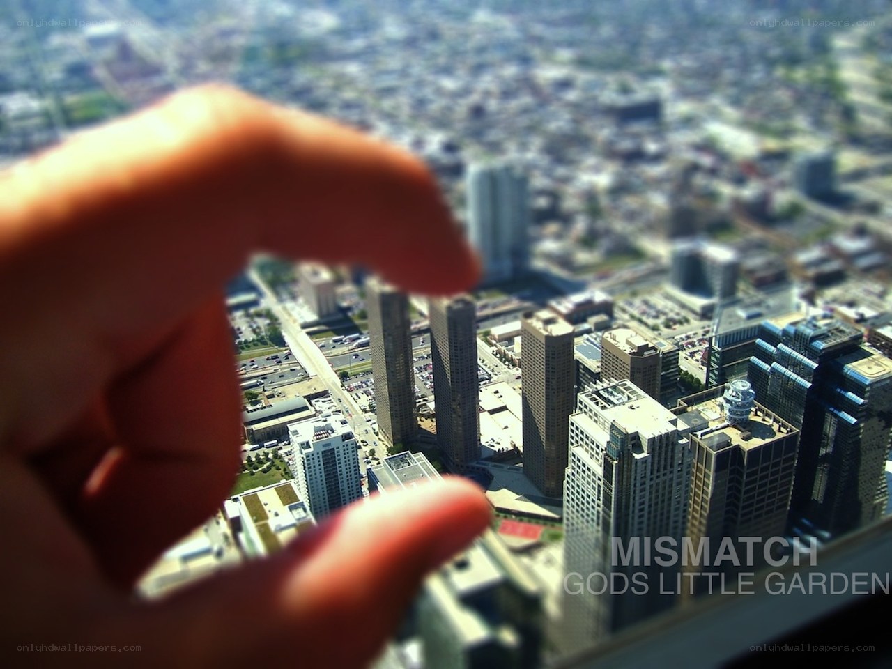 Hand holding miniature cityscape