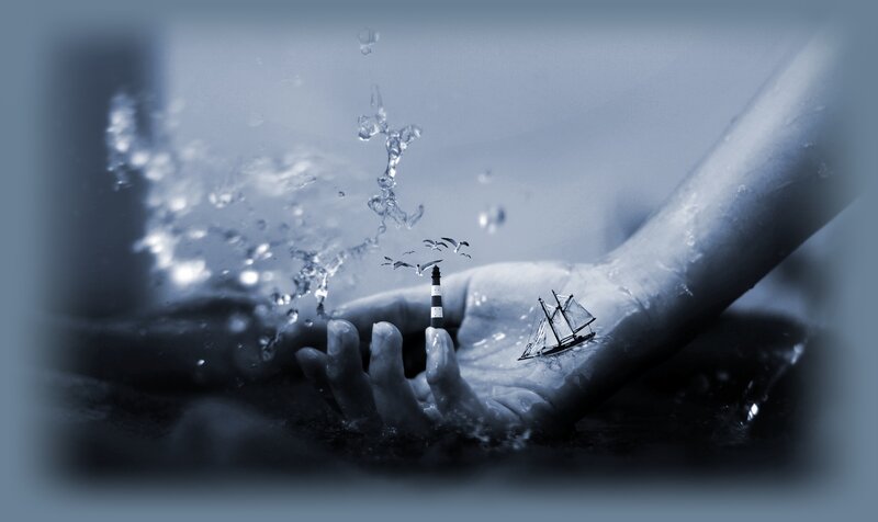 Hand Holding Miniature Ships