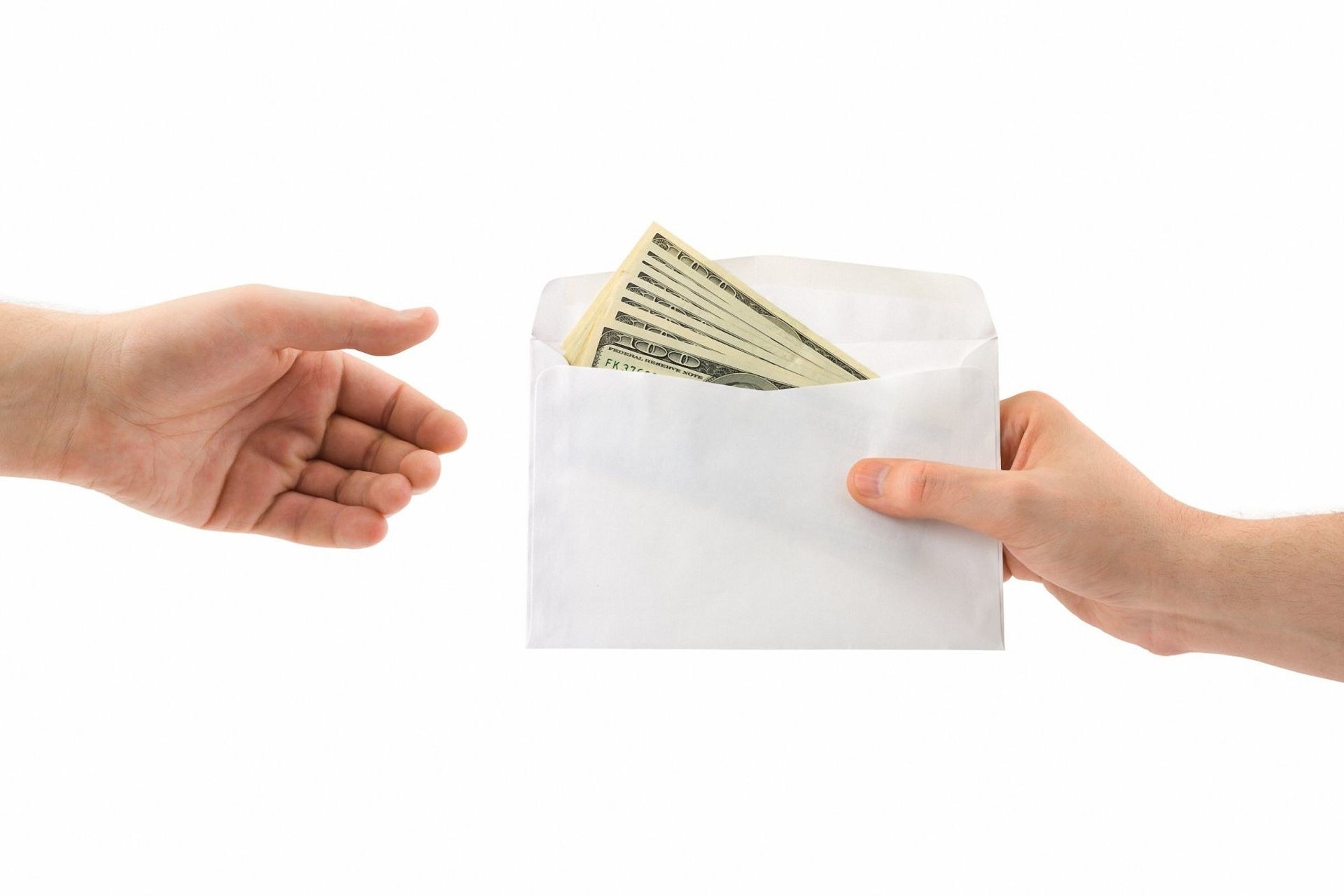 Hand holding money envelope