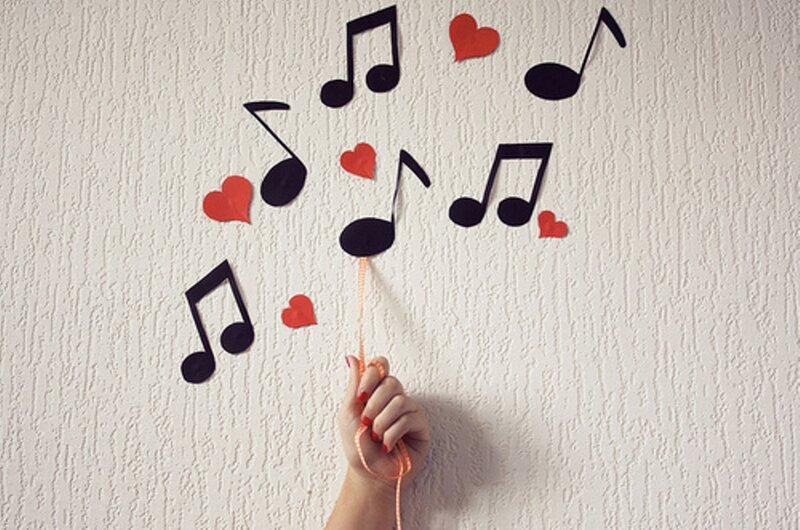 Hand Holding Music Notes
