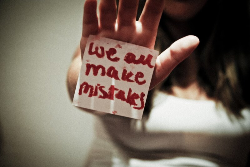 hand holding note with message