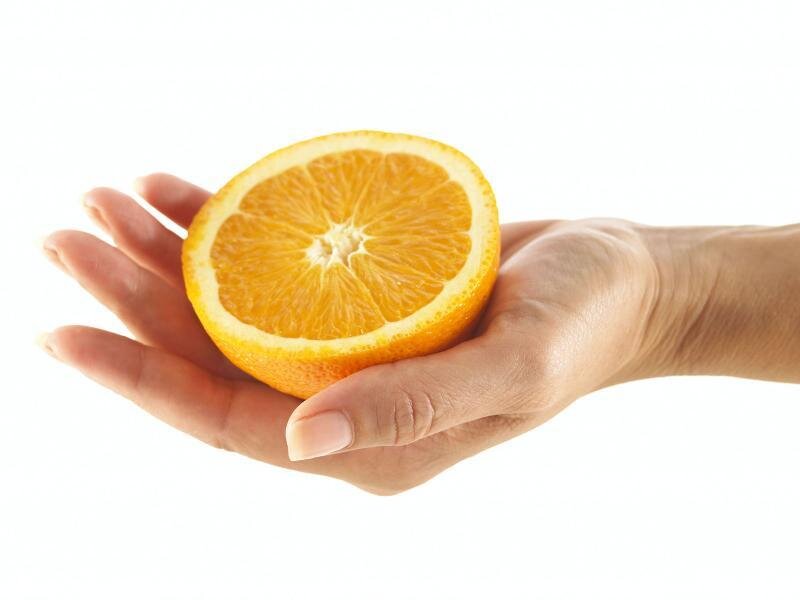 hand holding orange slice