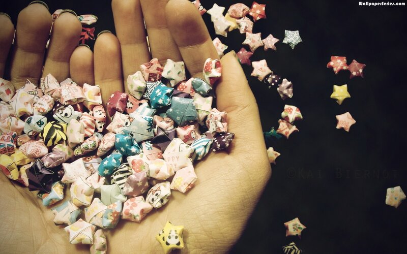 Hand Holding Origami Stars — Black