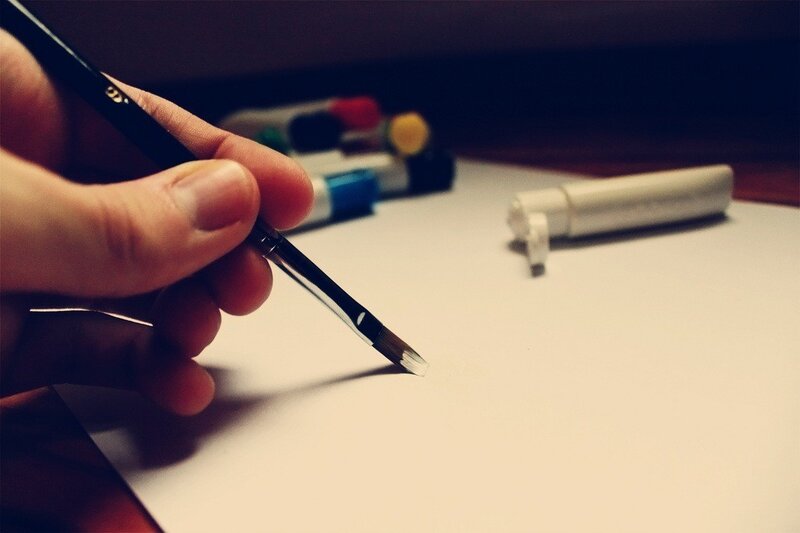 Hand Holding Paintbrush — White, Calm