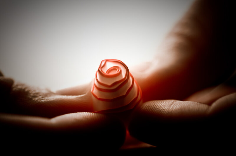 Hand holding paper rose