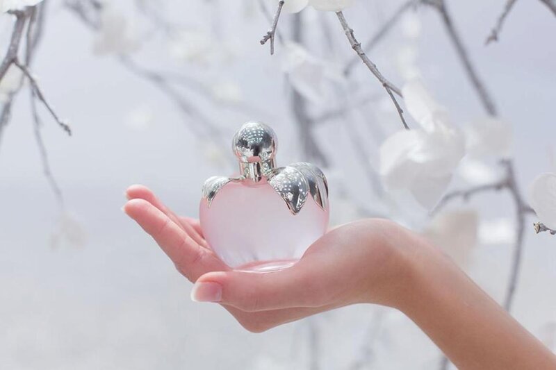 Hand Holding Perfume Bottle — Pink