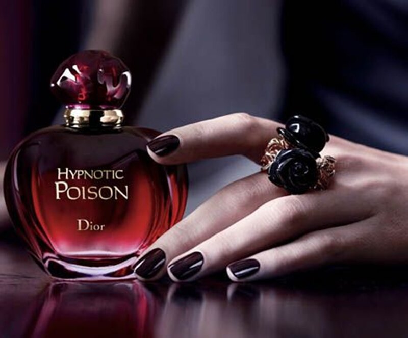 Hand Holding Perfume Bottle — Red, Dramatic