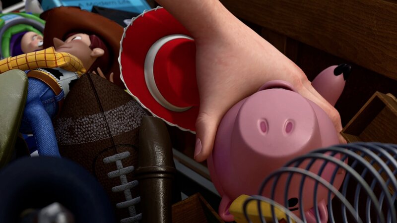 hand holding piggy bank toy