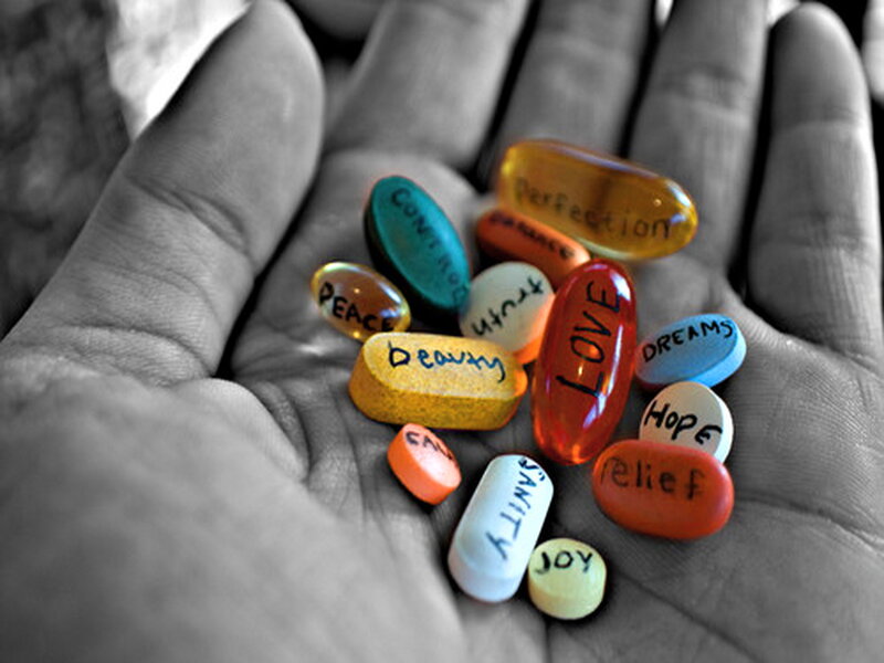 Hand Holding Pills