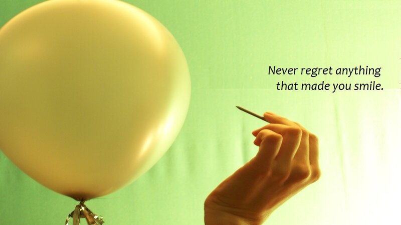 Hand Holding Pin Near Balloon