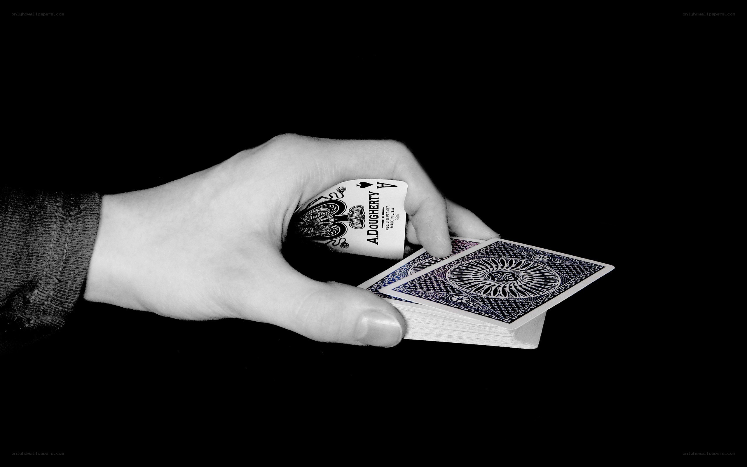 hand holding playing cards