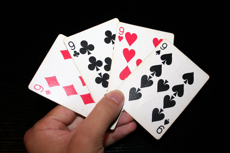 Hand Holding Playing Cards — Black, Neutral
