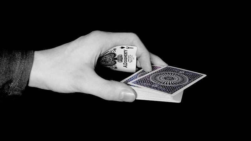 hand holding playing cards