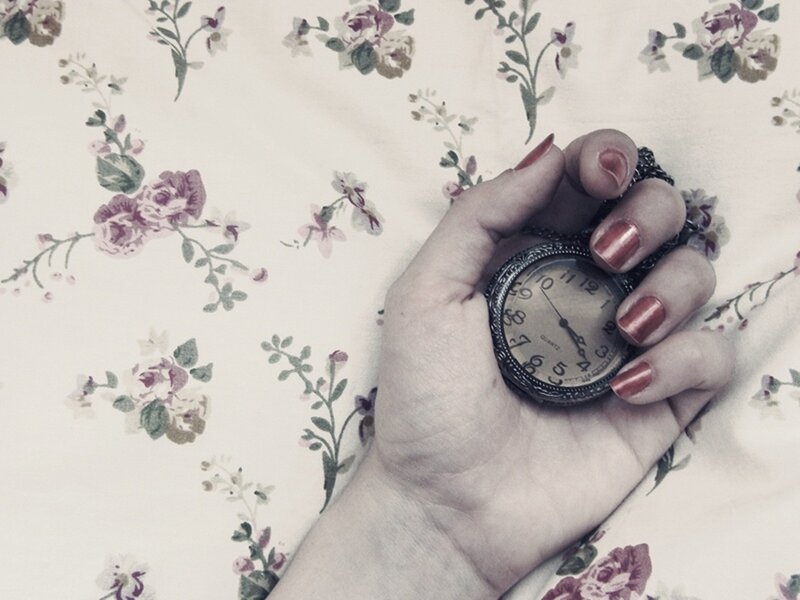 hand holding pocket watch