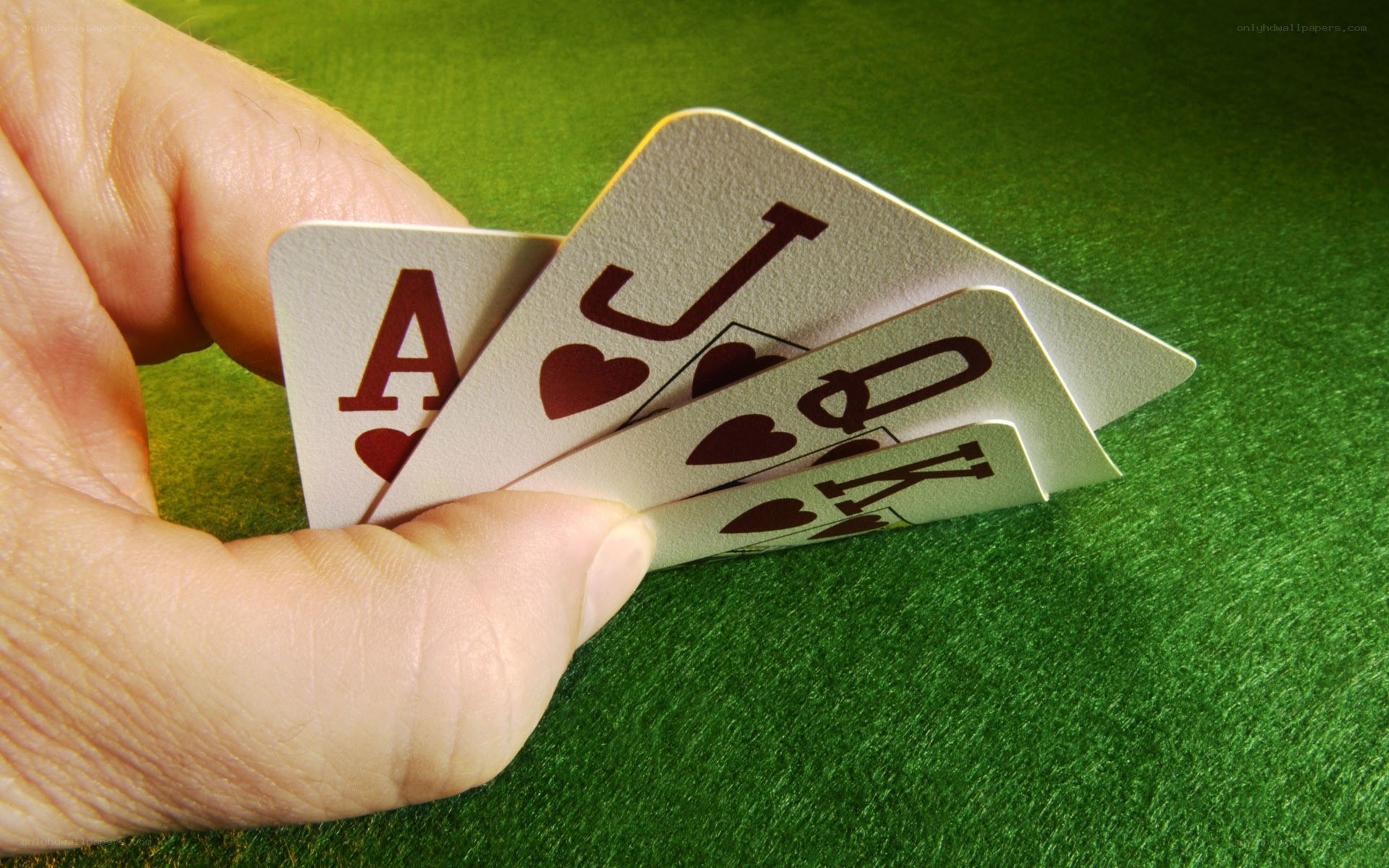 hand holding poker cards