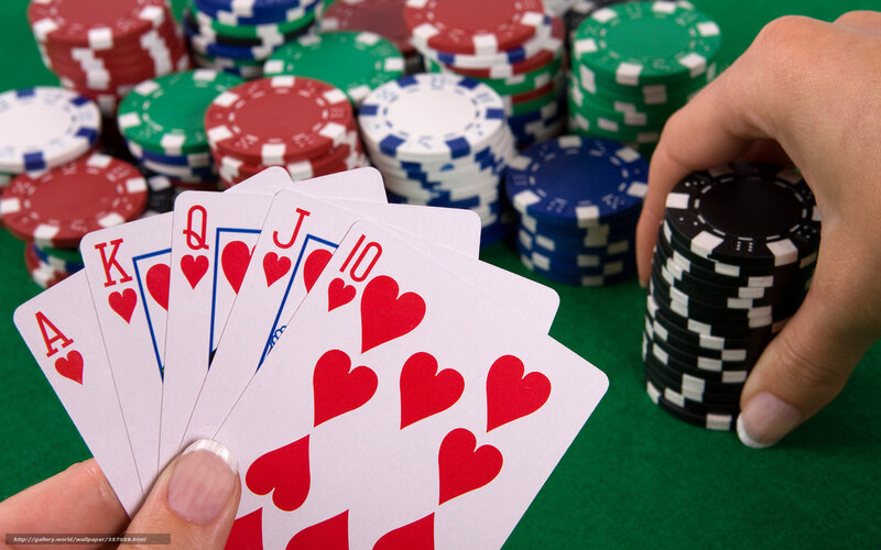 Hand Holding Poker Cards — Green, Tense