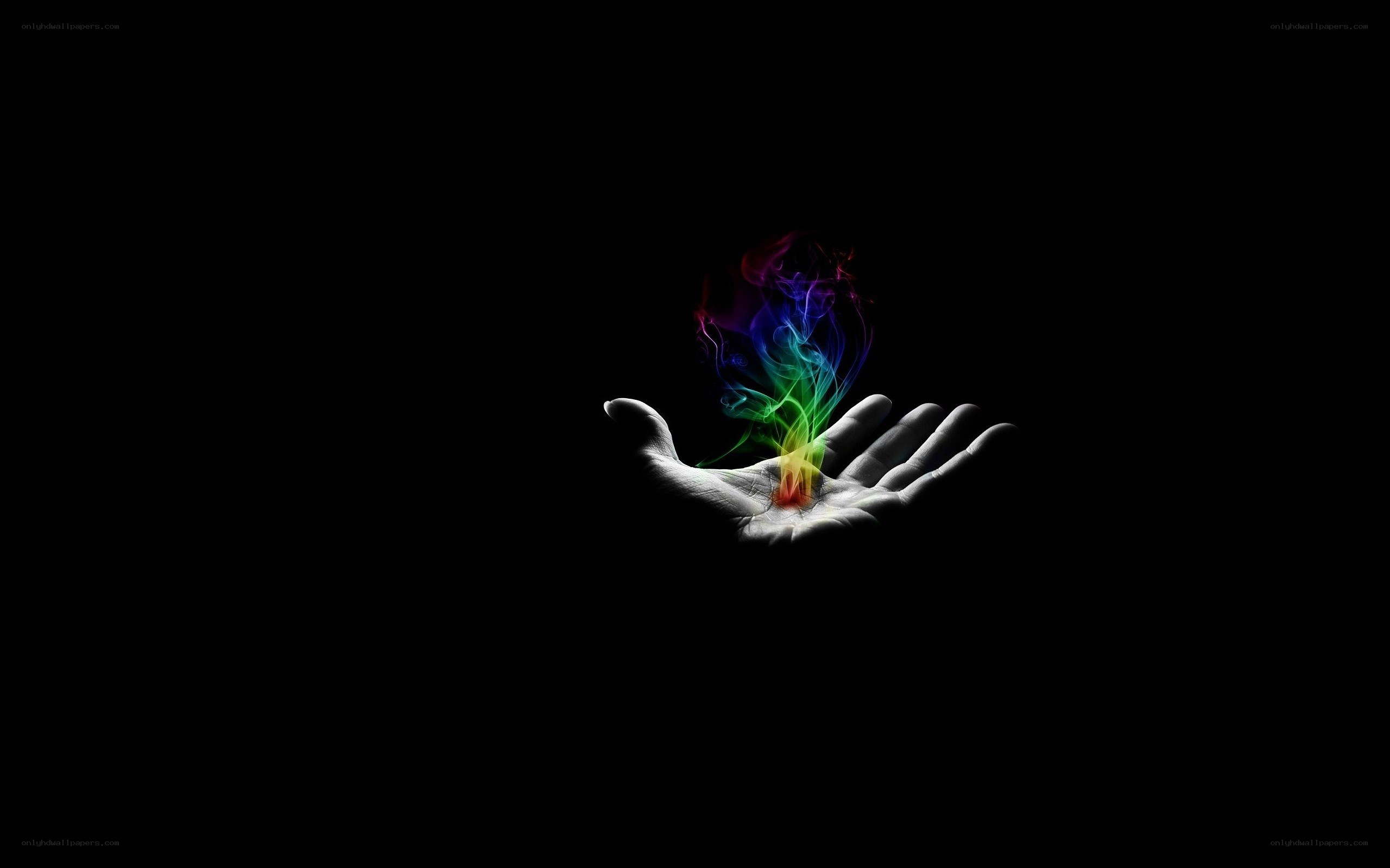 hand holding rainbow smoke