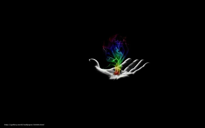 hand holding rainbow smoke