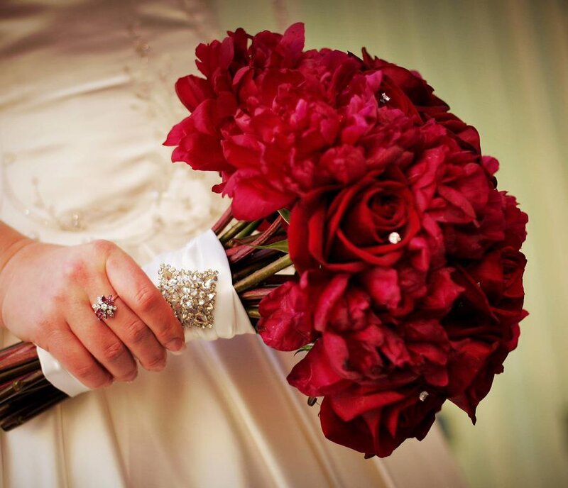 Hand Holding Red Bouquet