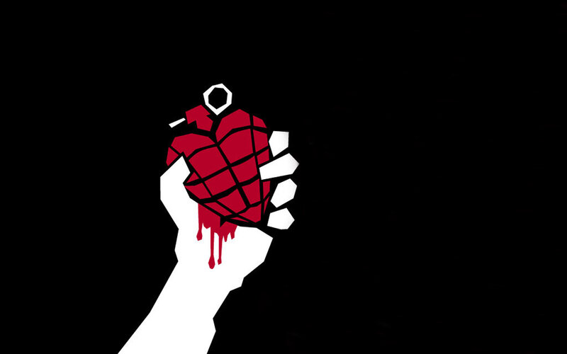 hand holding red grenade