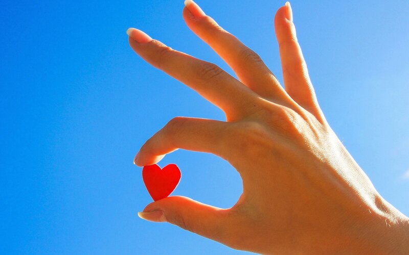 Hand Holding Red Heart — Blue
