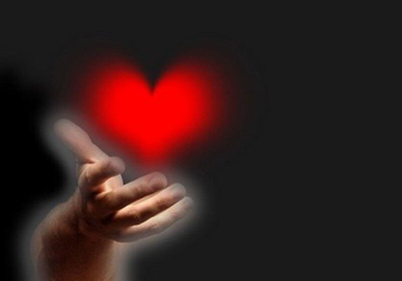 Hand Holding Red Heart — Dramatic, Photograph