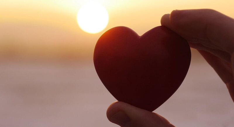 Hand Holding Red Heart — Serene