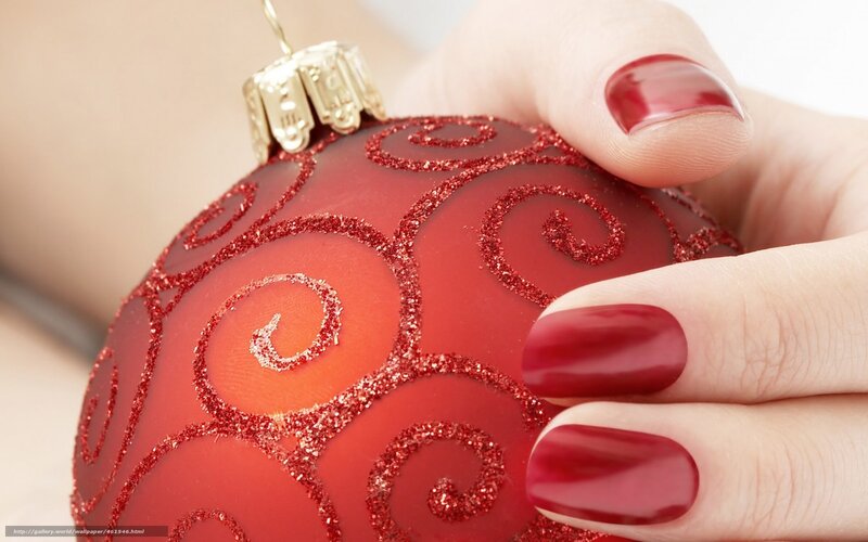 hand holding red ornament