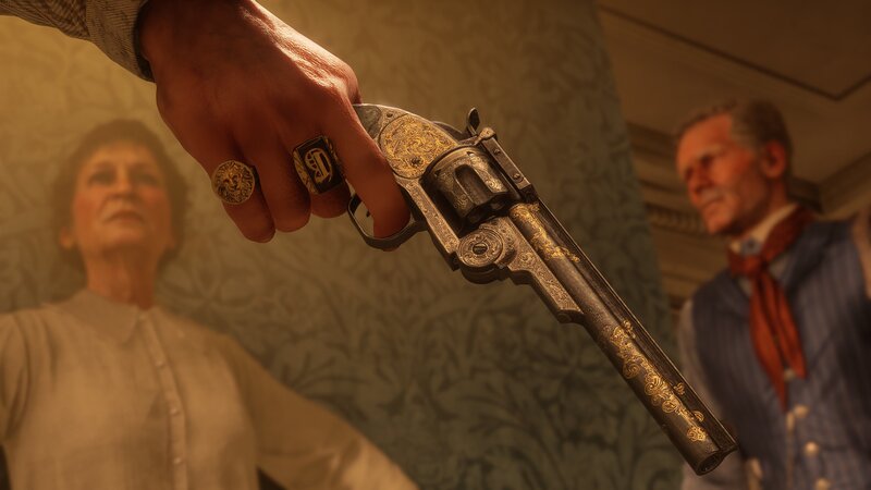 Hand Holding Revolver — Gold