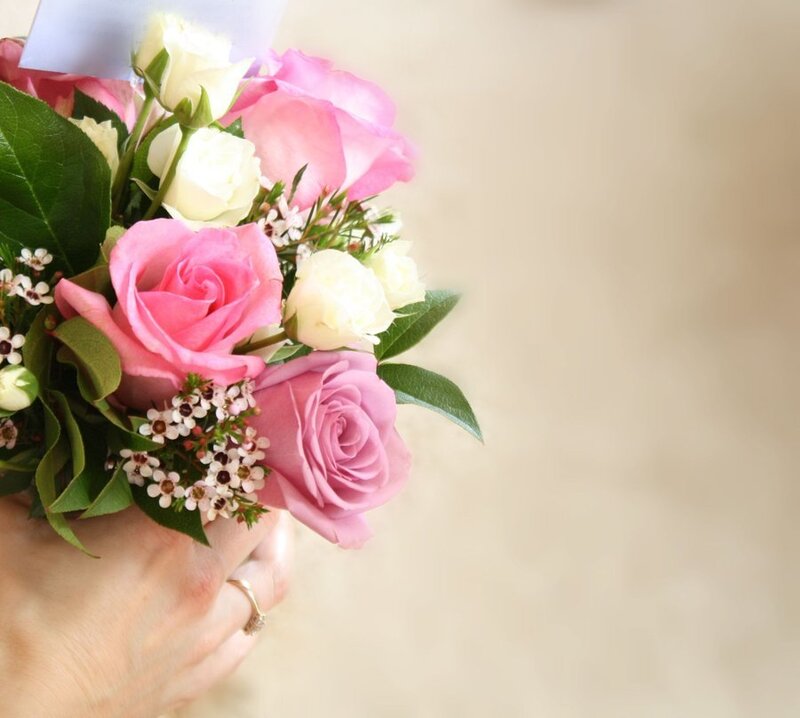 Hand Holding Rose Bouquet