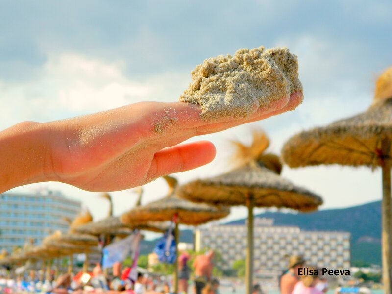Hand Holding Sand — Blue