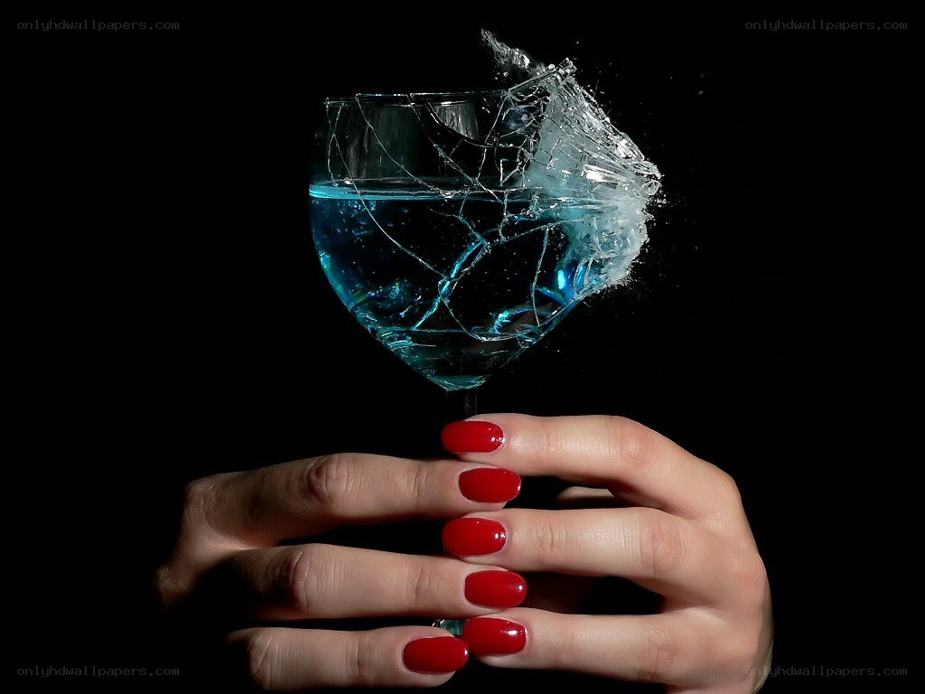 Hand holding shattered glass