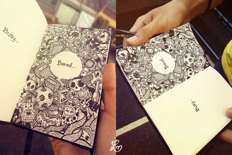 Hand Holding Sketchbook