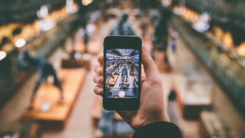 Hand Holding Smartphone — Brown