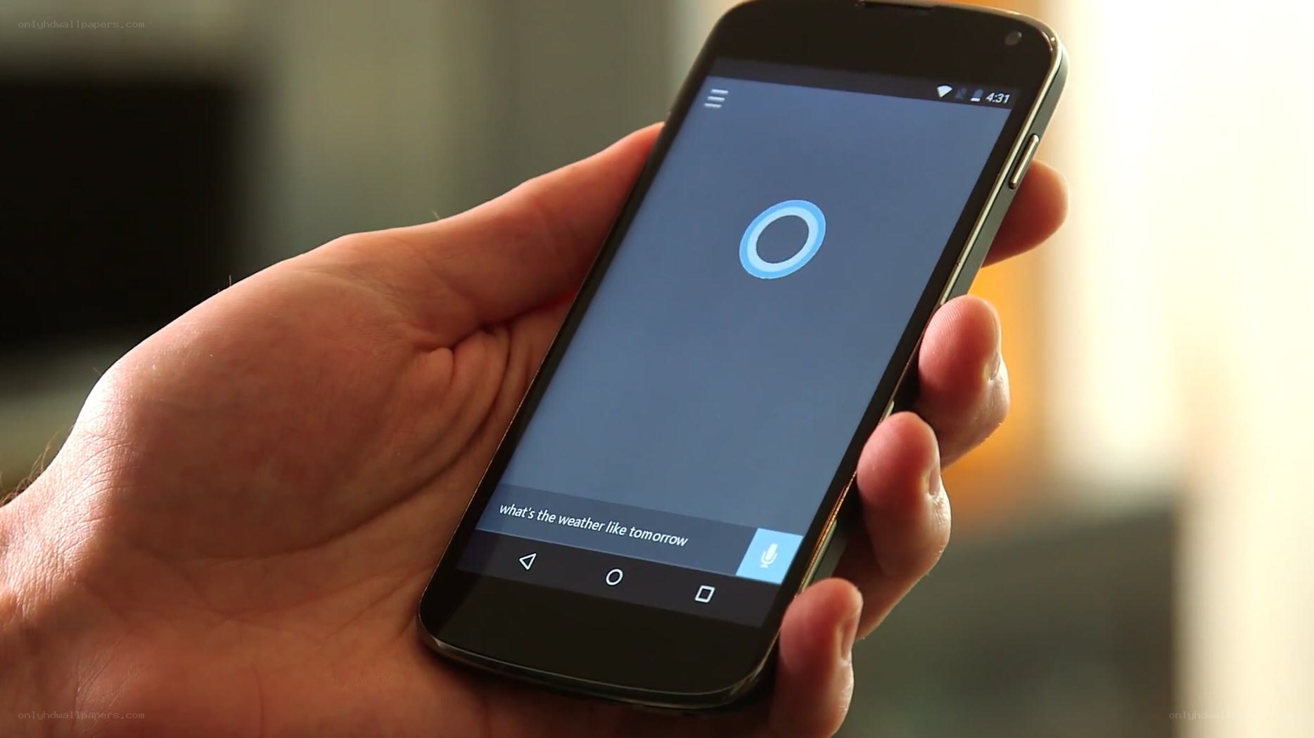 hand holding smartphone with voice assistant