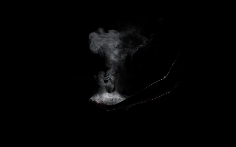 hand holding smoke