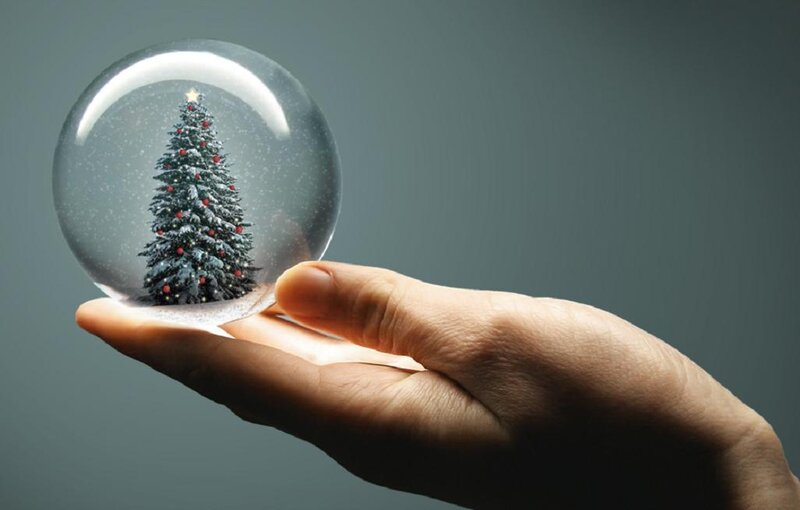 Hand Holding Snow Globe