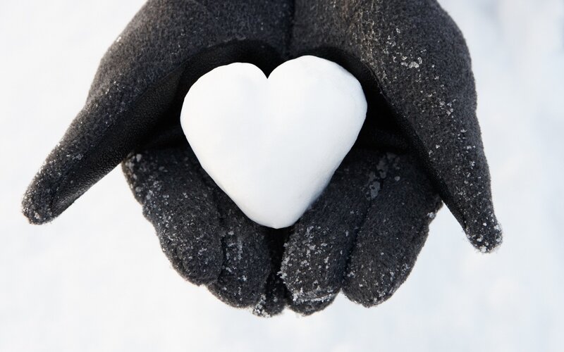 hand holding snow heart