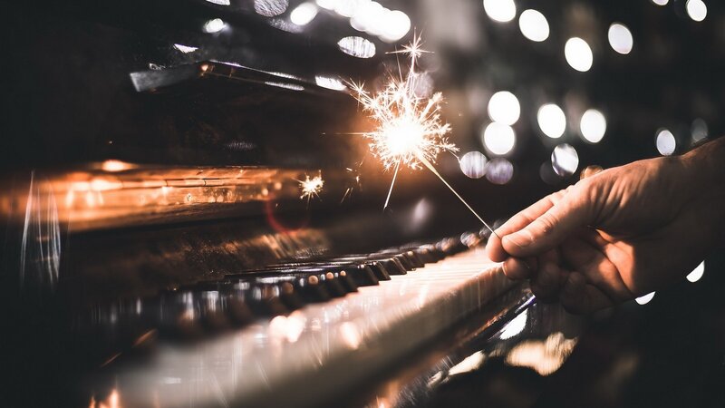 Hand Holding Sparkler — Black, Dramatic