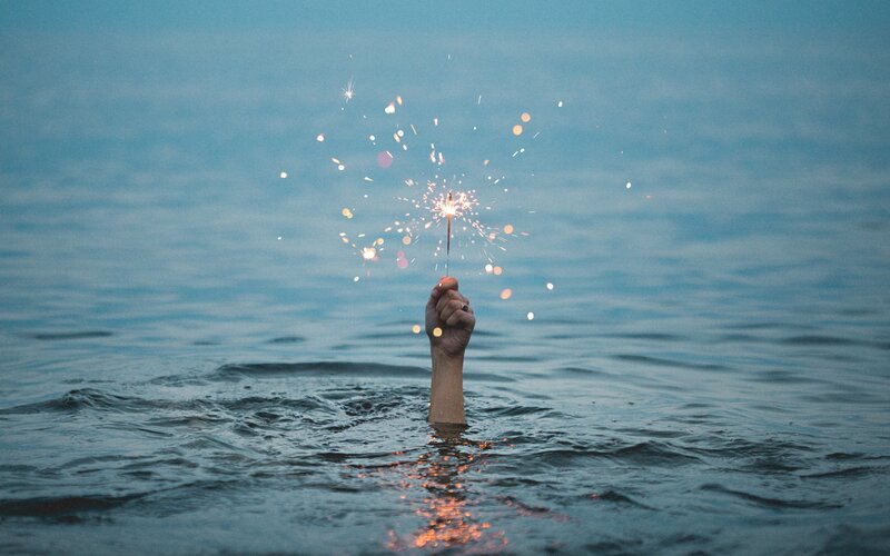 Hand Holding Sparkler — Blue