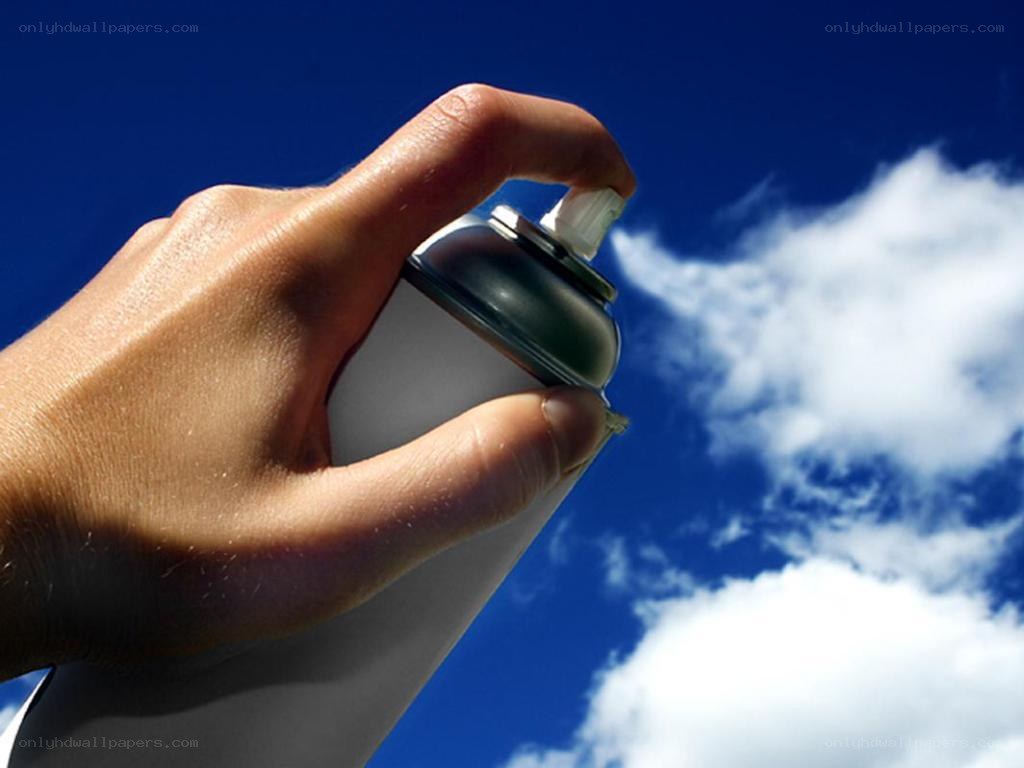 hand holding spray can